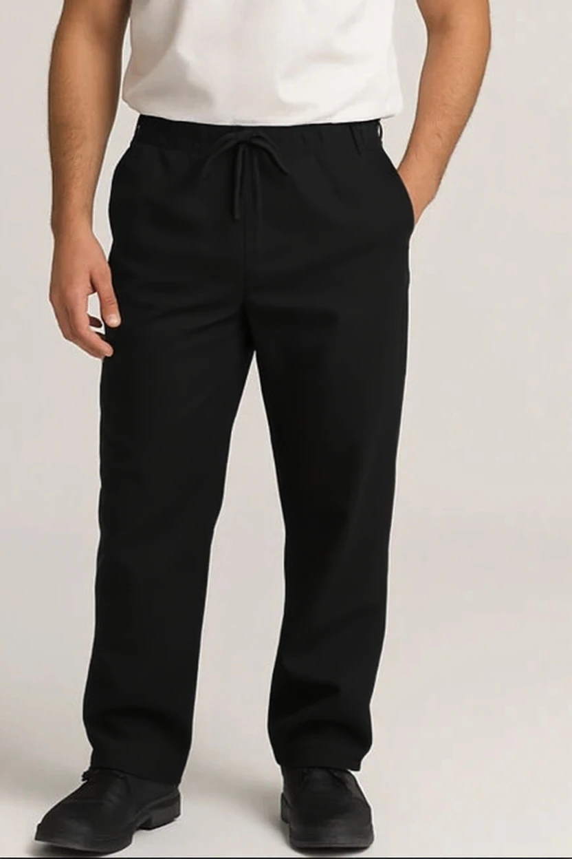 Person wearing black pants and a white shirt on a plain background