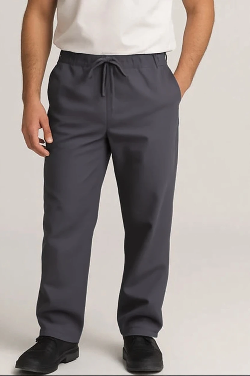 Person wearing gray pants and black shoes on a plain background