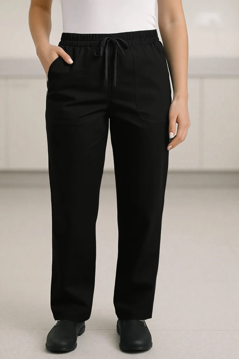 Person wearing black pants on a plain background