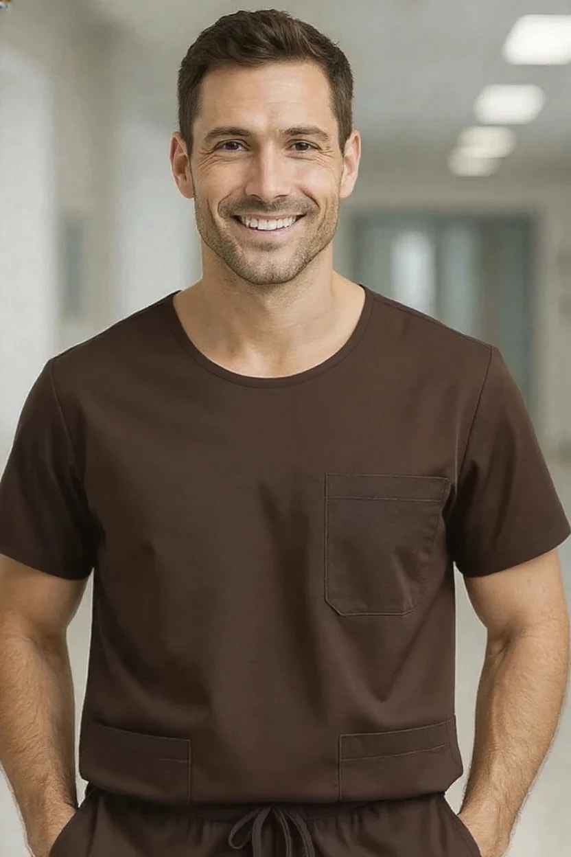 Man wearing a brown scrub set in a hospital setting