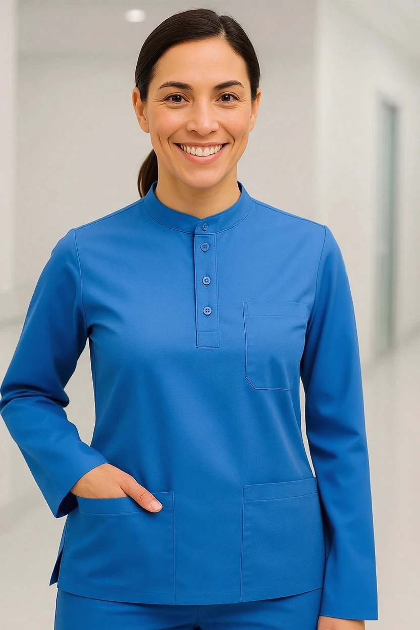 Person wearing a blue scrub top and pants in an indoor setting